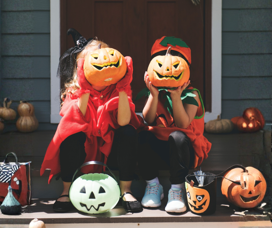 Little children in Halloween costumes